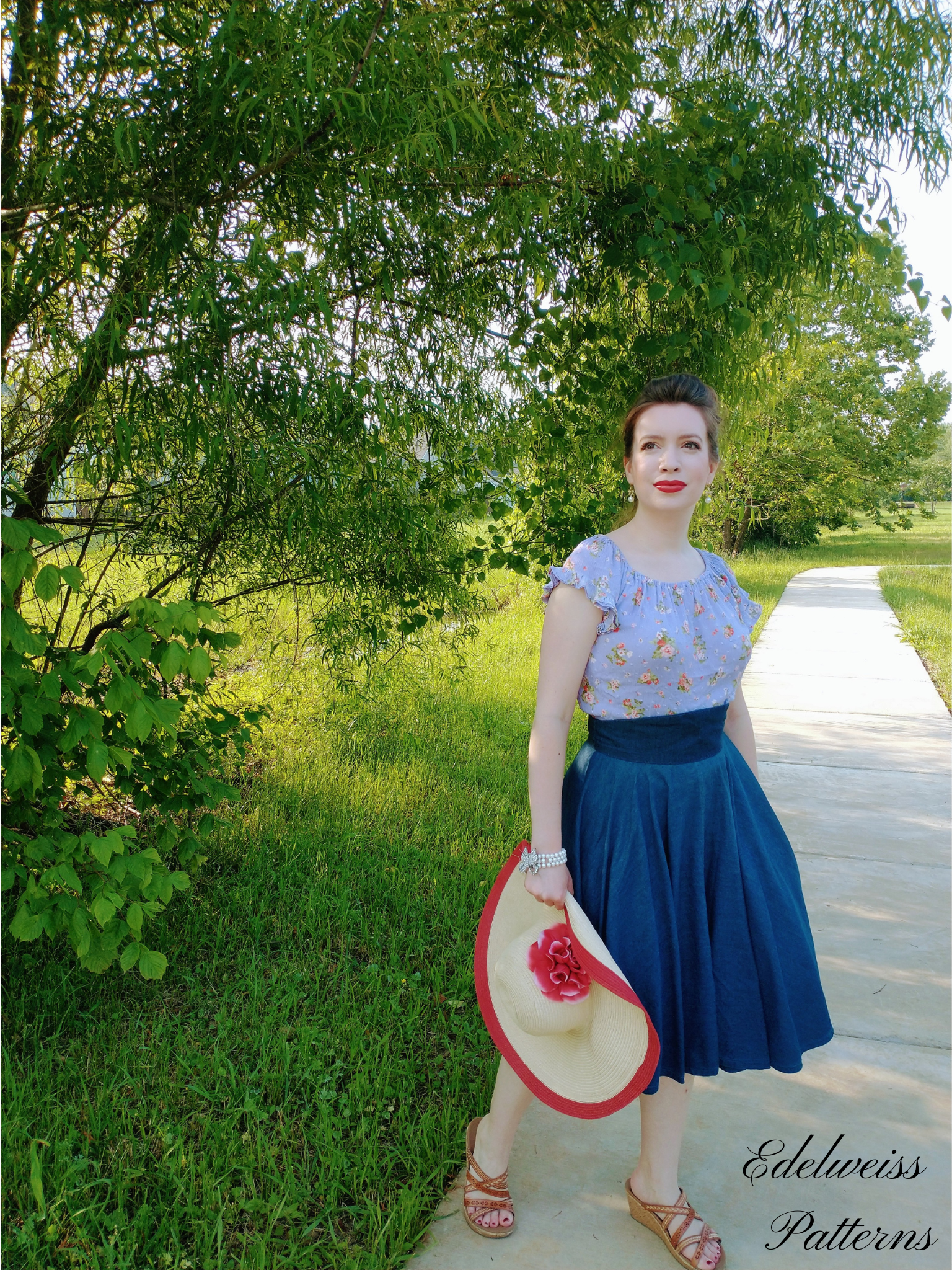 girl wearing 1950s skirt and vintage top in a field