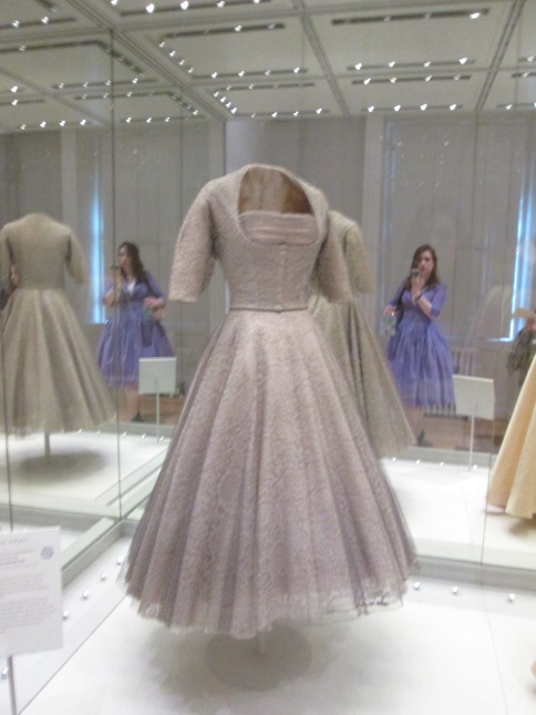 a 1950s dress on display in a museum