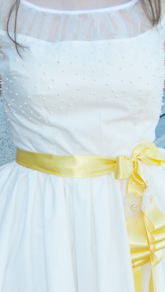 white-dress-yellow-sash